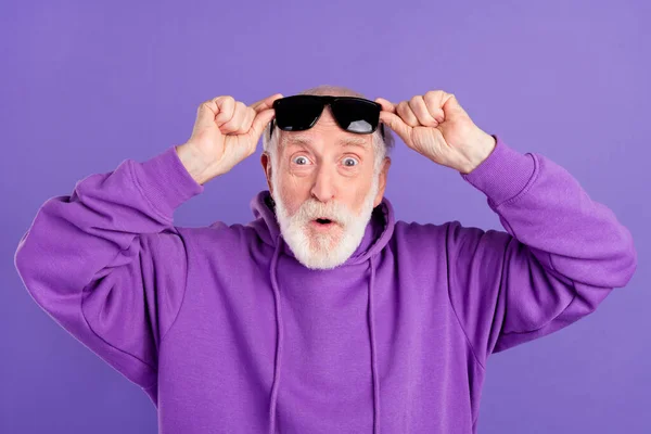 Portrait of attractive stunned grey-haired man good news reaction pout lips isolated over bright violet purple color background — Stock Photo, Image