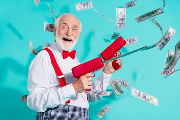 Portrait of attractive cheerful grey-haired man shooting us usd waste spend isolated over bright teal turquoise color background — Stock Photo, Image