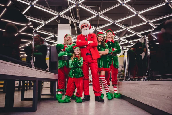 Full length body size view of attractive content super hero cheerful group elfs buying purchase folded arms at store department indoors — Stock Photo, Image