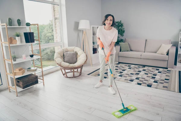 Full length body size photo woman cleaning the house washing floor staying at home tidy room