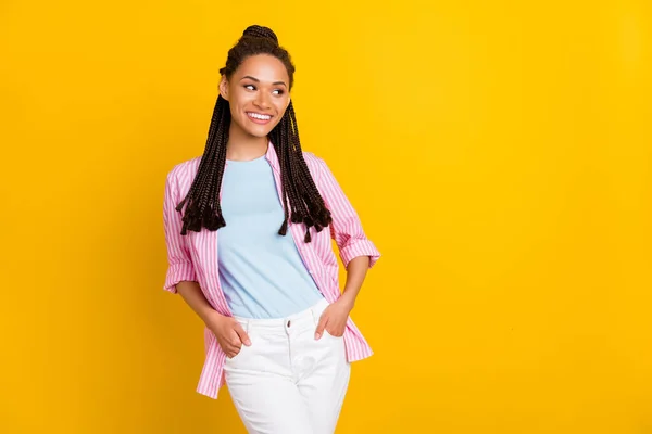 Photo of young happy afro american woman look empty space good mood isolated on yellow color background — Stock Photo, Image