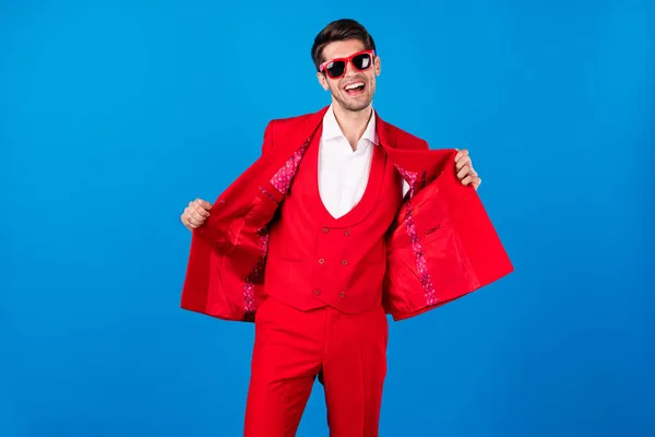 Photo of young handsome man happy positive smile wear elegant tuxedo isolated over blue color background — Stock Photo, Image