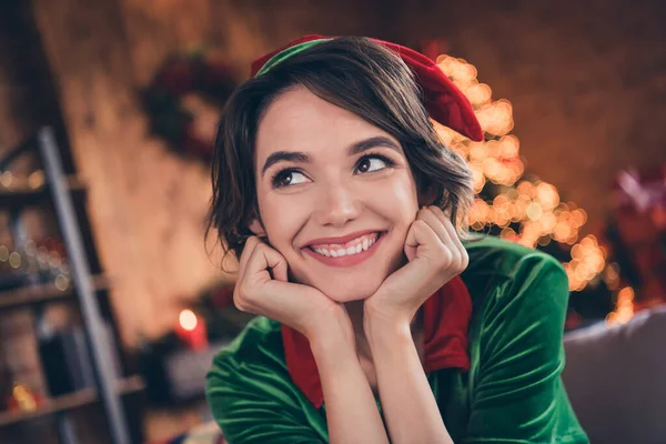 Photo of dreamy thoughtful cute pretty lady hands cheeks look up wear elf costume in decorated home indoors — Stock Photo, Image