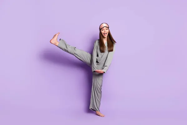 Full length body size view of lovely funny cheerful girl wear pajama having fun fooling isolated over violet purple color background — ストック写真