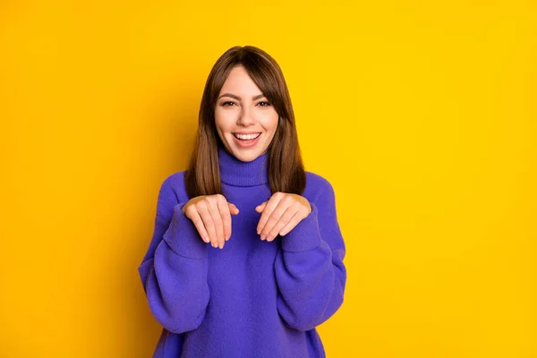 Portrait of atraktif cheerful girl having fun show like rabbit paaws isolated over bright yellow color background — Stok Foto