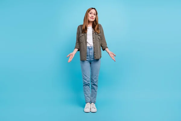 Full body photo of unhappy mature woman shrug shoulders no idea uncertain isolated on blue color background — Stock Photo, Image