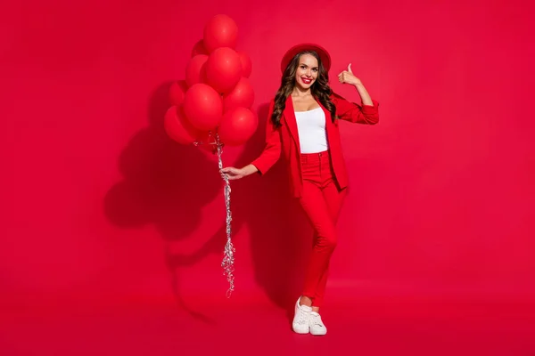 Full Size Photo Cool Brunette Lady Hold Balloons Show Thumb — стоковое фото