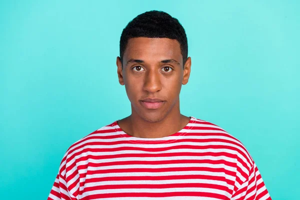 Photo of serious confident young man wear striped t-shirt isolated teal color background — Stock Photo, Image