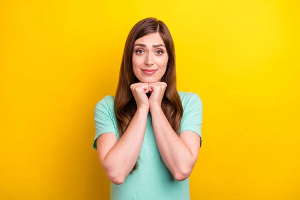Photo of ask brunette hairdo young lady wear teal t-shirt isolated on yellow color background — Stock Photo, Image