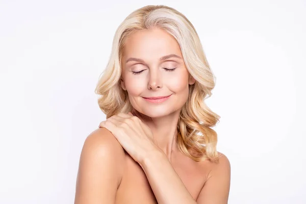 Portrait of attractive dreamy cheerful healthy grey-haired woman touching clean clean skin shower isolated over white color background — Stock Photo, Image