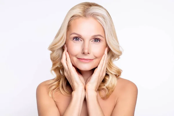 Portrait of attractive healthy grey-haired woman touching pure skin domestic facial massage isolated over white color background — Stock Photo, Image