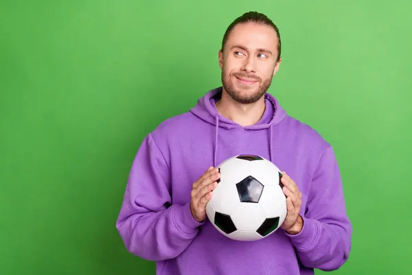 Photo of smart guy leader trainer hold soccer ball imagine world cup win wear jumper sweater isolated over green color background