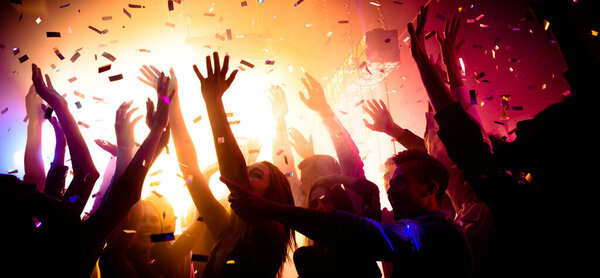 Photo of carefree clubbers blurred movement enjoy electro star performance raise hands up festival confetti modern neon filter — Stock Photo, Image