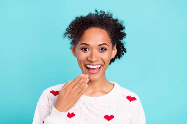 Photo of impressed funny african lady dressed white sweater arm lips open mouth smiling isolated blue color background.