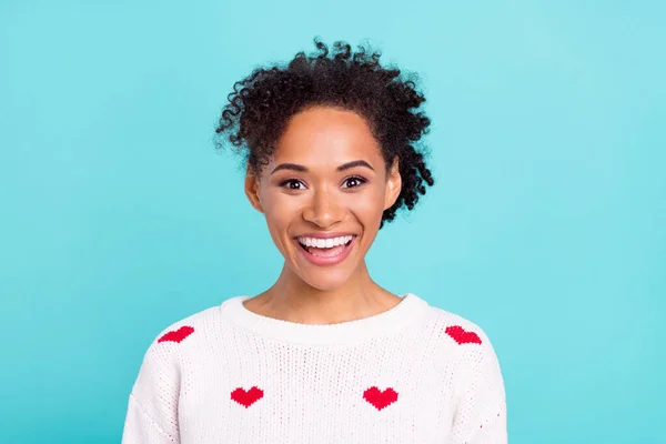 Photo of pretty excited african lady dressed white sweater smiling isolated blue color background.