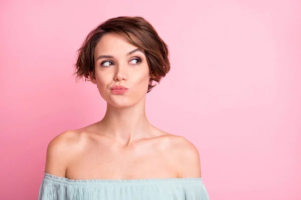 Photo of young attractive woman unhappy upset uncertain hesitate doubt look empty space isolated over pink color background.