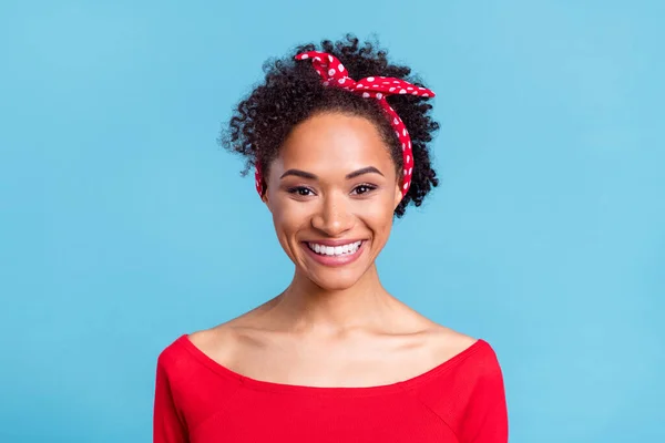 Photo of adorable sweet afro girl wear off-shoulders red shirt smiling isolated blue color background.