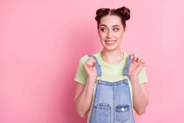 Photo portrait girl in overall cheerful looking blank space smiling isolated pastel pink color background — Stock Photo, Image