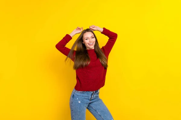 Portrait of attractive cheerful carefree girl posing air blowing hair isolated over bright yellow color background — Stock Photo, Image