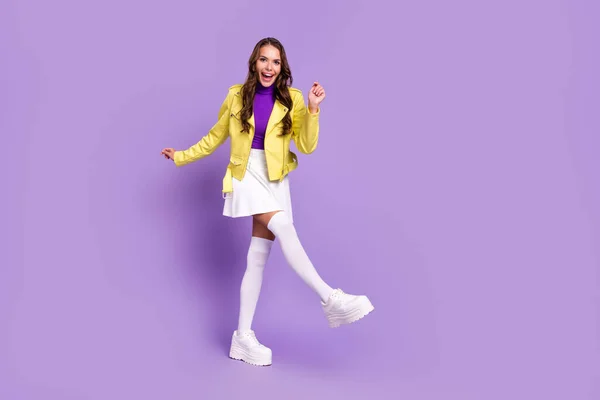 Full length photo of young cheerful girl have fun dancer party modern outfit platform isolated over purple color background — Stock Photo, Image