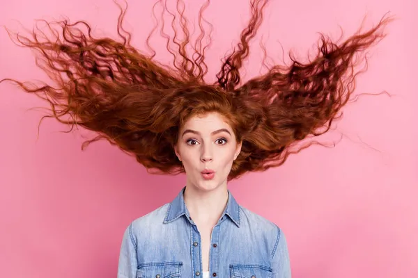 Photo of cheerful young positive lady shocked face fly wind hair sale news reaction isolated on pink color background — Stock Photo, Image