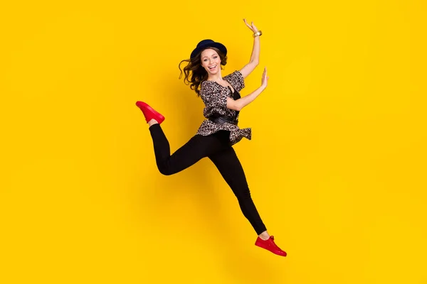 Full length photo of stunning charming young woman jump up raise hands leg isolated on yellow color background — Stock Photo, Image