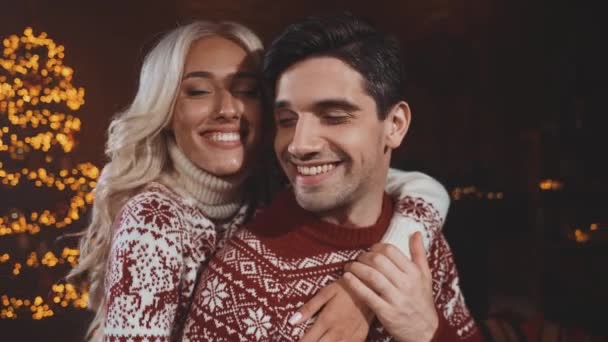 Cute spouses lady guy cuddle x mas newyear tree illumination indoors — Stock Video