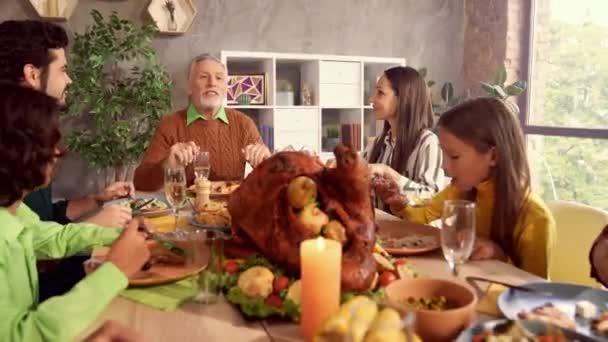 People gathering holiday table grandpa tell story — Stock Video