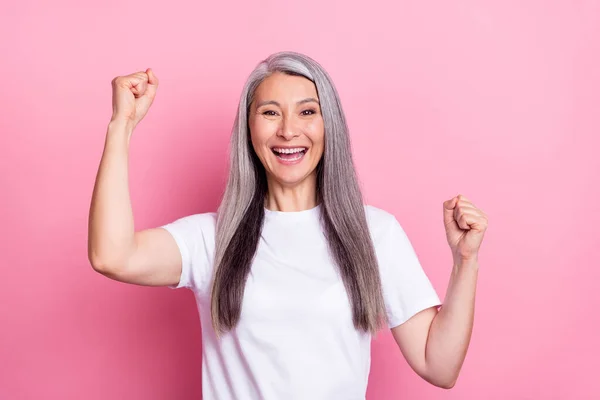 Portrait of attractive lucky cheerful woman rejoicing having fun isolated over pink pastel color background — Zdjęcie stockowe