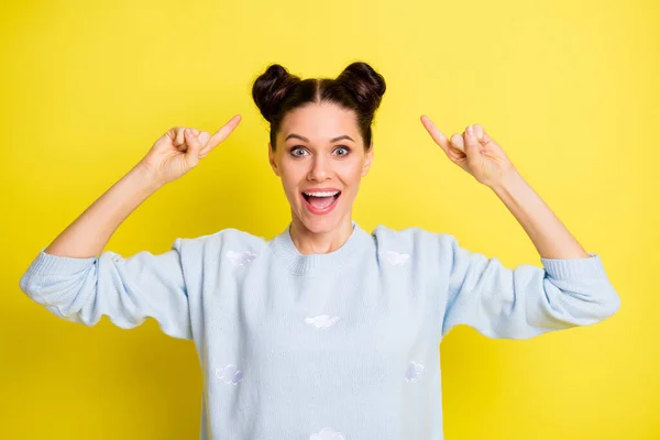 Portrait of attractive amazed girlish cheerful girl demonstrating hairdo coiffure having fun isolated over bright yellow color background — Stock Photo, Image