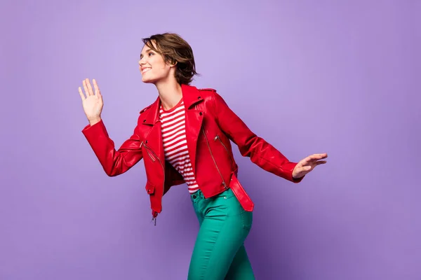 Adatlap side photo of young cheerful girl happy positive smile look empty space wave hello isolated over purple color background — Stock Fotó