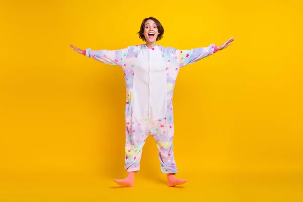 Full length body size photo girl in unicorn costume laughing overjoyed isolated bright yellow color background — Stock Photo, Image