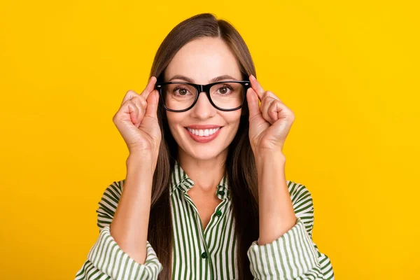 Foto av ung vacker dam händer röra glasögon ögonläkare smart isolerad över gul färg bakgrund — Stockfoto