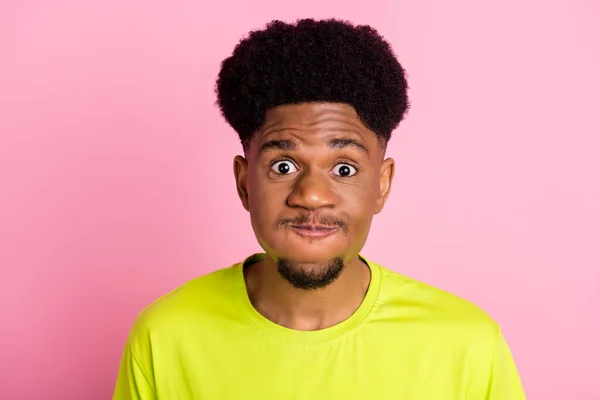 Photo of young african guy hold breath air pouted cheeks fooling grimace dumb isolated over pink color background — Fotografia de Stock