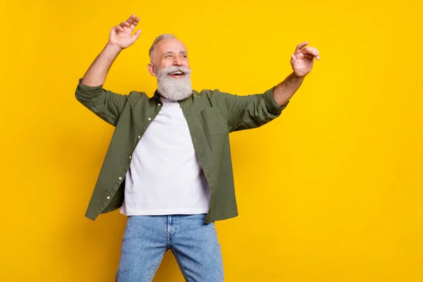 Photo portrait of grandfather cheerful happy dancing relaxing at party isolated bright yellow color background — Stock Photo, Image