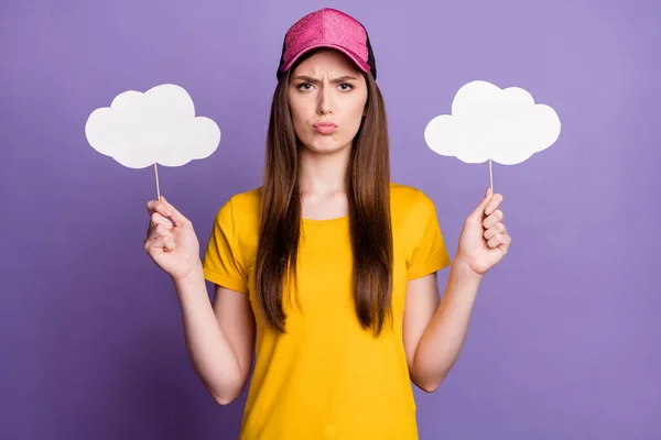 Photo of unhappy upset young woman hold hands clouds weather wear cap isolated on purple color background — Stock Photo, Image