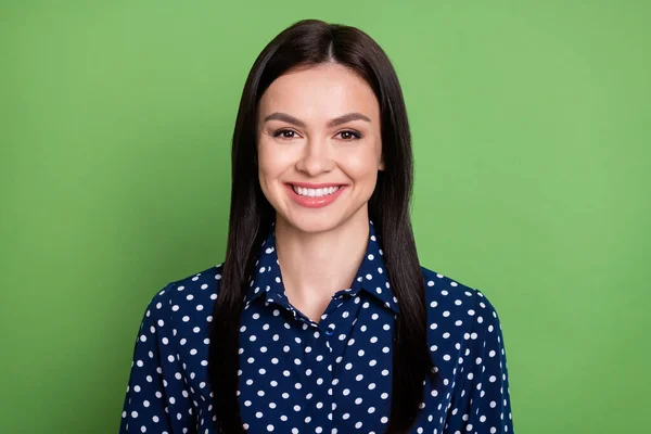 Photo of happy nice young woman good mood face wear blue dotted shirt isolated on green color background — Stock Photo, Image