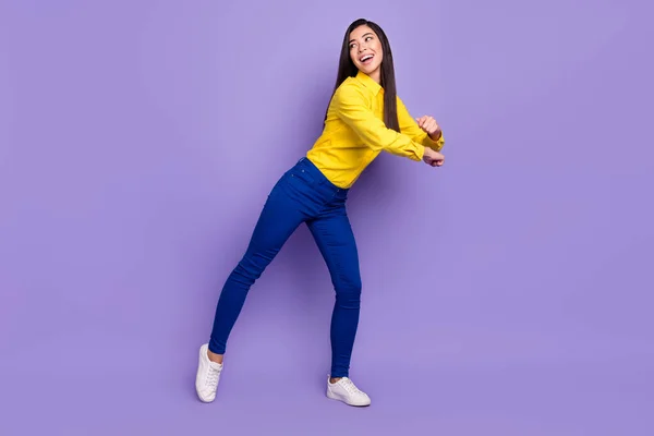 Full length photo of charming funky young woman look empty space dance isolated on violet color background — Stock Photo, Image