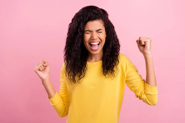 Photo of young excited black girl happy positive smile rejoice victory lucky success fists hands isolated over pink color background — Stockfoto