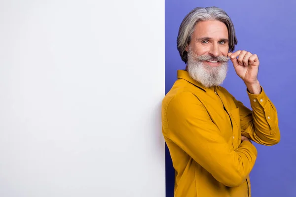 Portrait of attractive cheery gray-haired man copy space touching moustache isolated over bright violet purple color background — Stock Photo, Image