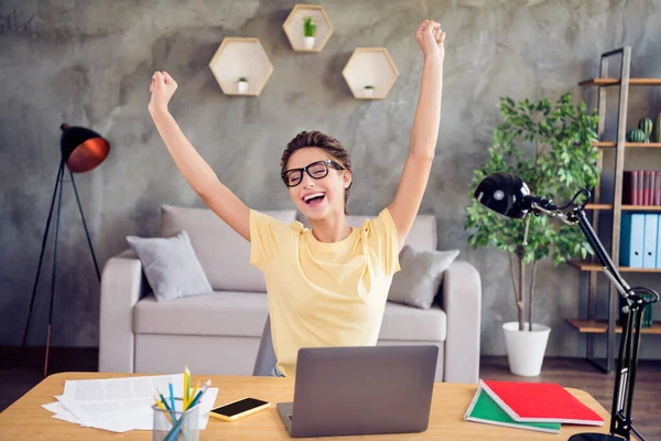 Portrait of attractive cheerful dreamy girl using laptop stretching celebrating at home loft industrial interior indoors — Stock Photo, Image