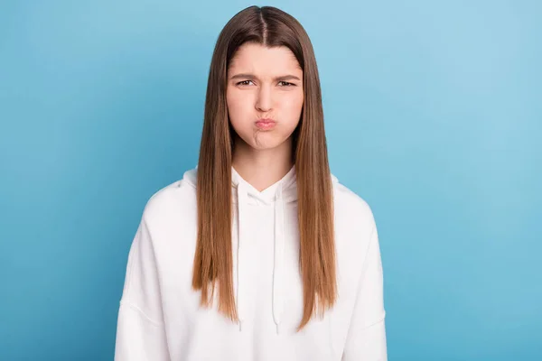 Foto retrato menina segurando ar nas bochechas vestindo sportswear isolado pastel azul cor fundo — Fotografia de Stock