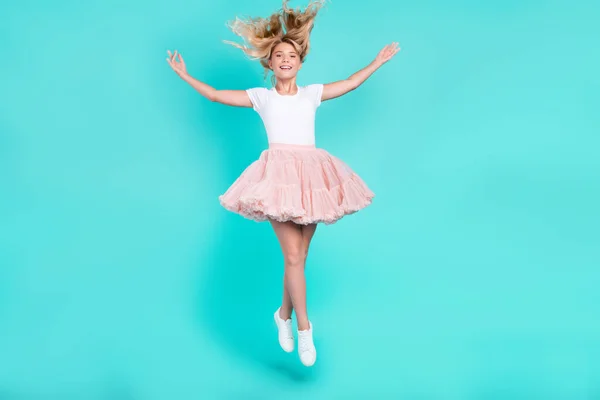 Photo of lovely cute candid lady jump throw hair wear white t-shirt skirt shoes isolated aquamarine color background — Stock Photo, Image