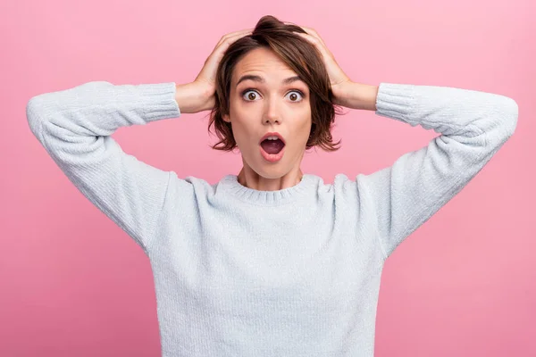 Photo of crazy amazed astonished lady open mouth hands head wear blue sweater isolated pink color background — Stockfoto
