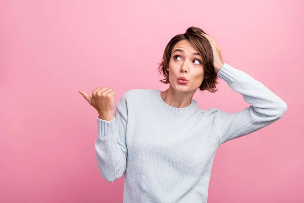 Photo of excited lady hand head direct finger empty space wear blue sweater isolated pink color background — 图库照片