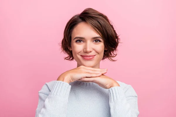 Photo of positive adorable lady hands chin look camera wear blue pullover isolated pink color background — Stockfoto