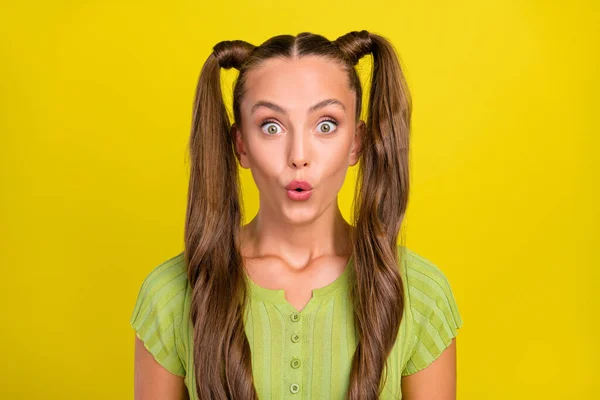 Portrait of attractive amazed cheerful brown-haired girl news reaction isolated over bright yellow color background — Stockfoto