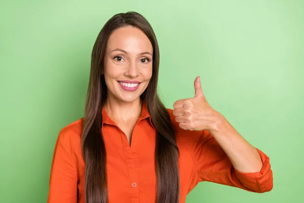 Photo of young charming woman show thumb-up advert good promoter isolated over green color background — Foto Stock