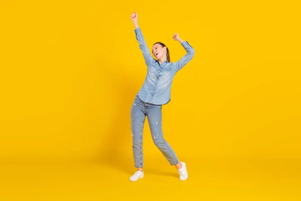 Full length body size photo smiling girl laughing dancing at party overjoyed isolated vivid yellow color background — Stockfoto