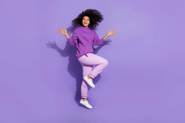 Full body portrait of attractive overjoyed wavy hairdo lady toothy smile enjoy free time isolated on violet color background — Stockfoto